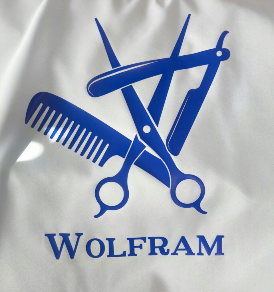 Hair Salon & Barber Cape with Pre-Designed Logo. Customizable Text for a Unique, Branded Look for Professional Stylists and Barbers.