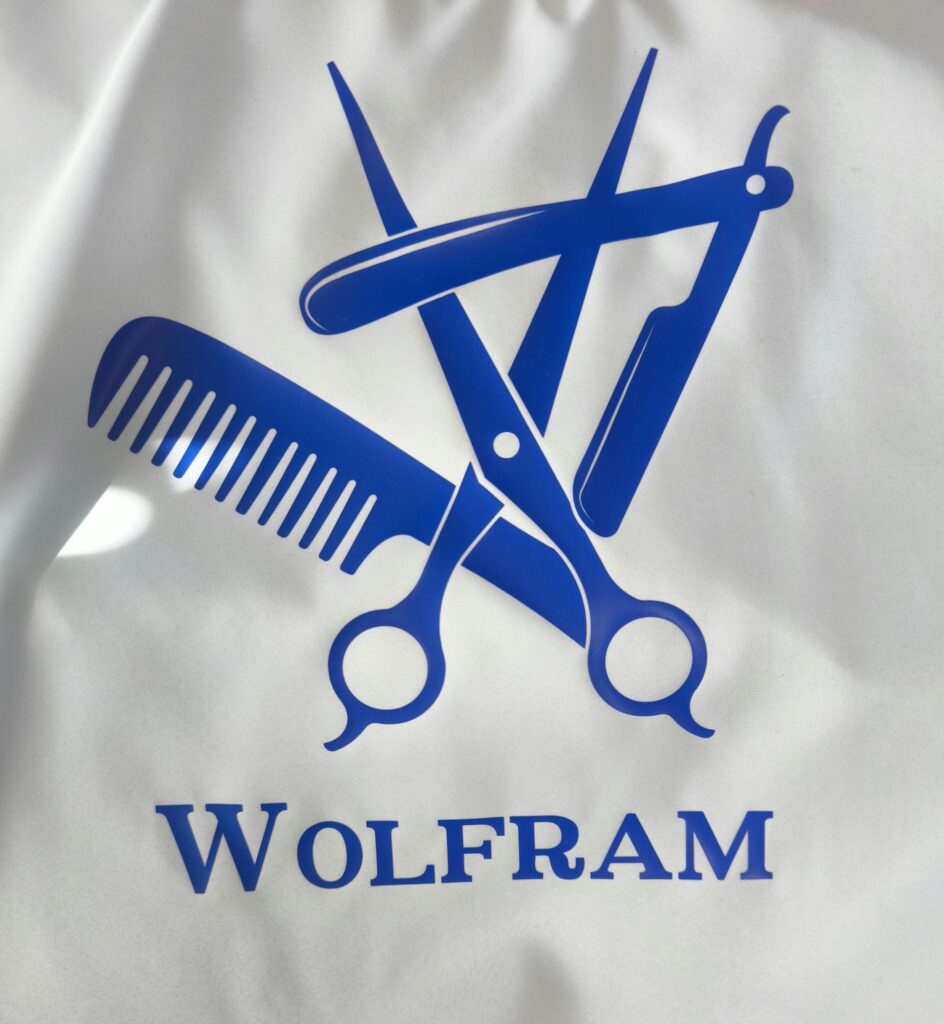 Hair Salon & Barber Cape with Pre-Designed Logo. Customizable Text for a Unique, Branded Look for Professional Stylists and Barbers.