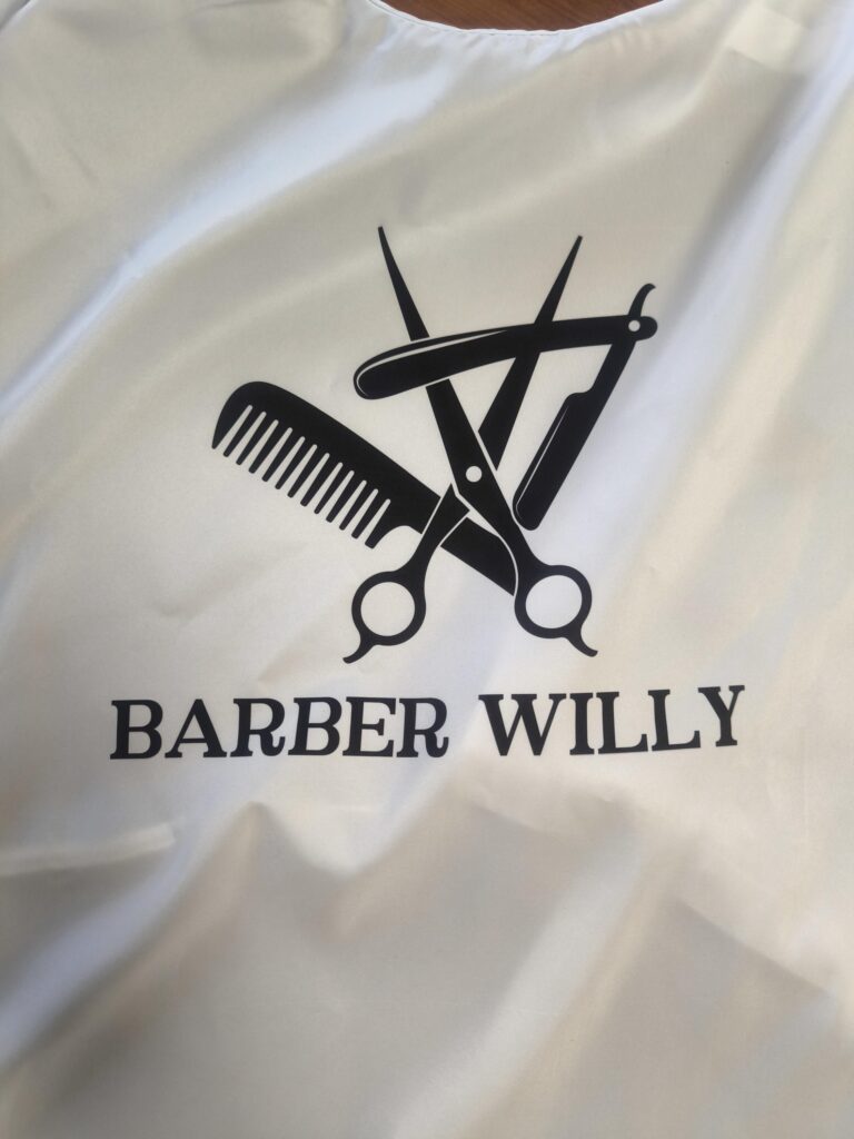 Hair Salon & Barber Cape with Pre-Designed Logo. Customizable Text for a Unique, Branded Look for Professional Stylists and Barbers.