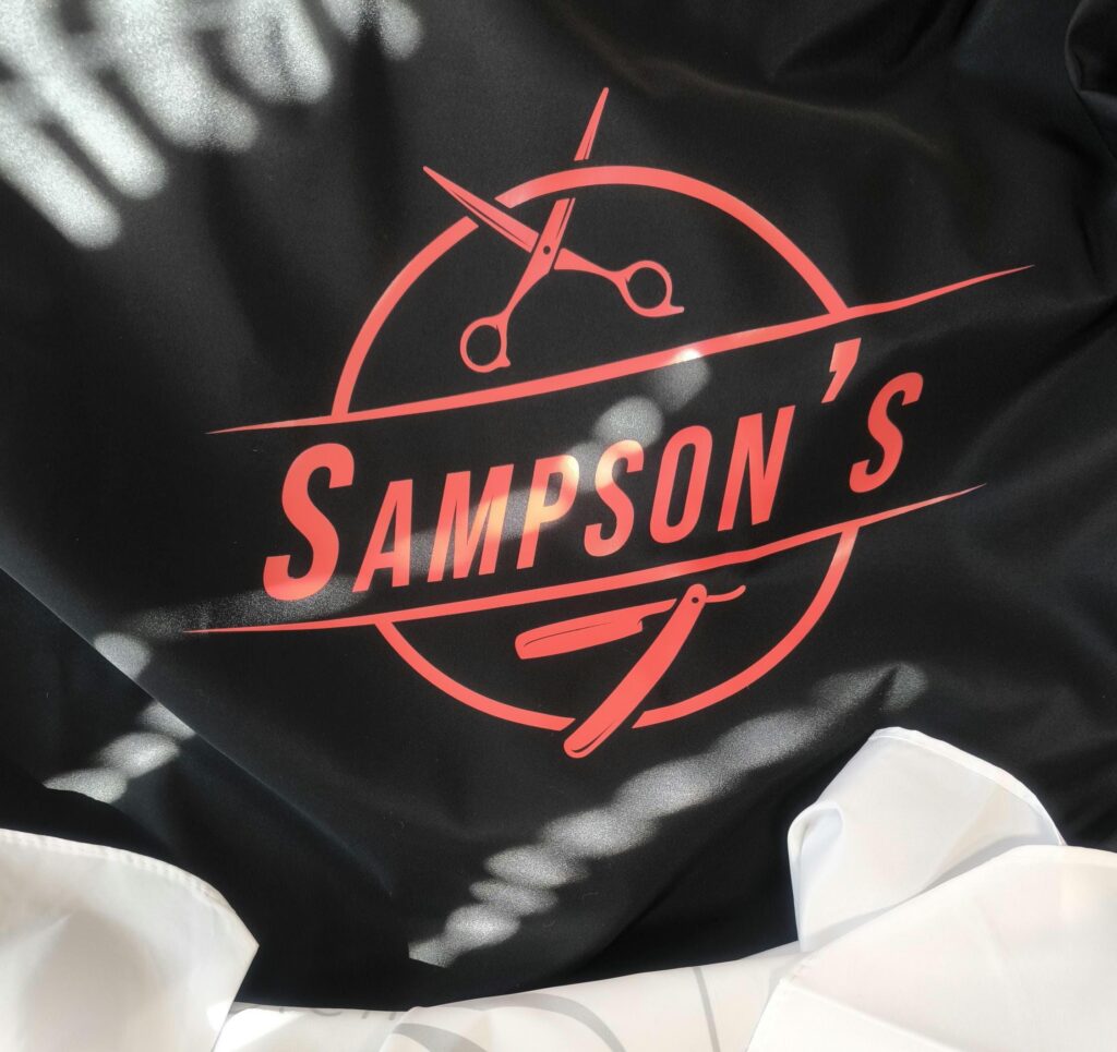 Haircutting Cape with Pre-Made Logo for Salons & Barbers – Customizable Text
